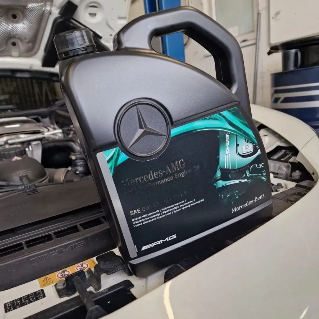 Genuine Mercedes-AMG high performance engine oil being used during a service